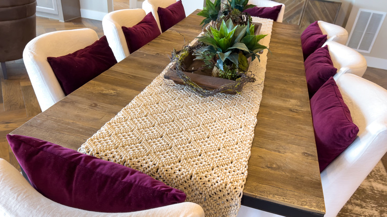 A dining room with a long rectangular table