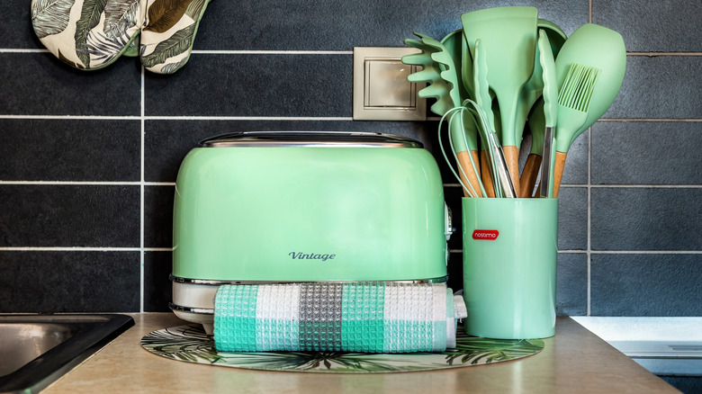 Navy blue toaster and kettle on a counter