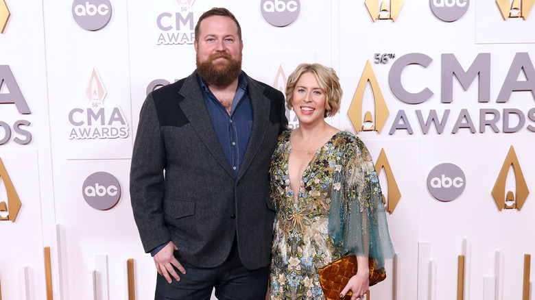Erin Napier and husband Ben Napier walk the red carpet at the CMA Awards.