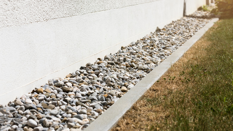pebble drainage line near house