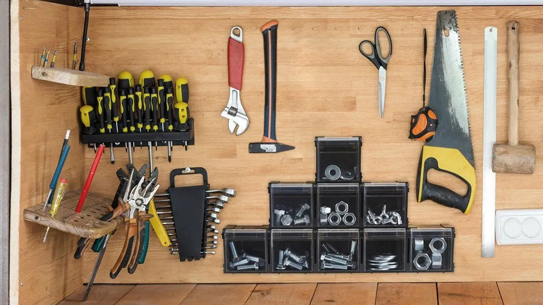 A DIY tool station organized with Storehouse's 4-inch Stacking Tilt Bins