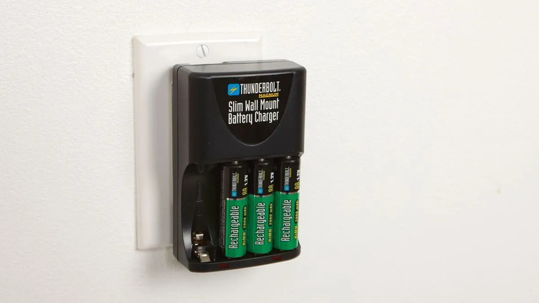 Thunderbolt Magnum's Slim Wall-Mount Battery Charger plugged into an outlet on a white wall