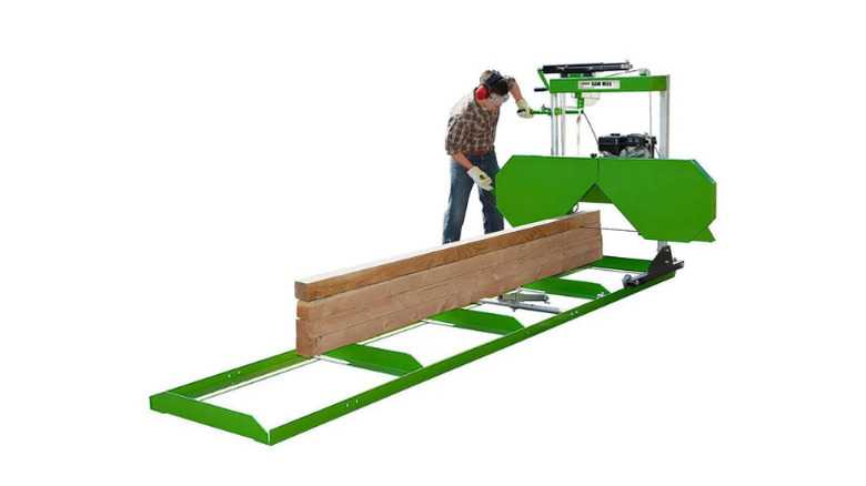 A man using Central Machinery's gas-powered sawmill