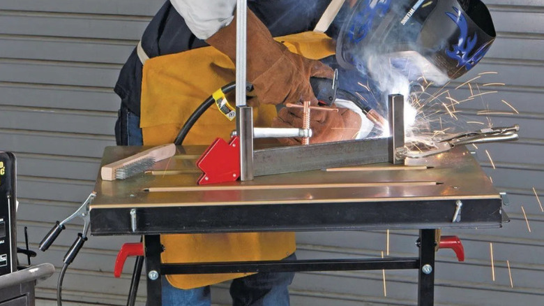 Chicago Electric's Adjustable Steel Welding Cart in use