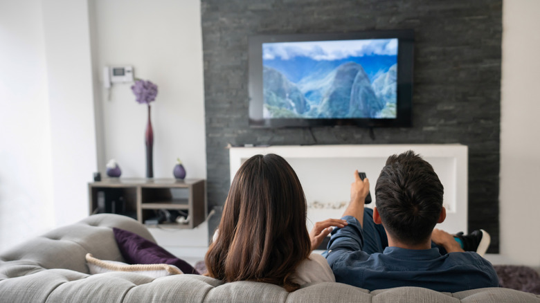 A couple enjoying a movie in their home theater