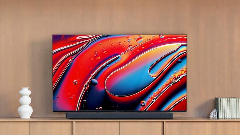 A shot of a living room showing a TV with the Sony BRAVIA Theater Bar 9 Soundbar with 13 Speakers underneath