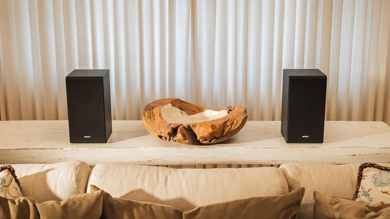 The Sony SS-CS5M2 3-Way 3-Driver Hi-Res Compact Bookshelf Speakers on a wood shelf