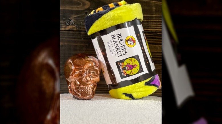 Halloween Buc-ee's plush blanket with skull statue