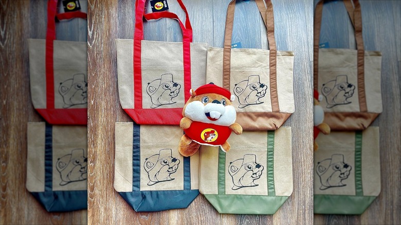 Buc-ee's tote bags with a stuffed Buc-ee Beaver