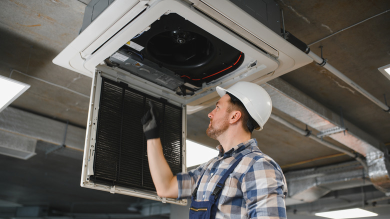 engineer cleaning HVAC