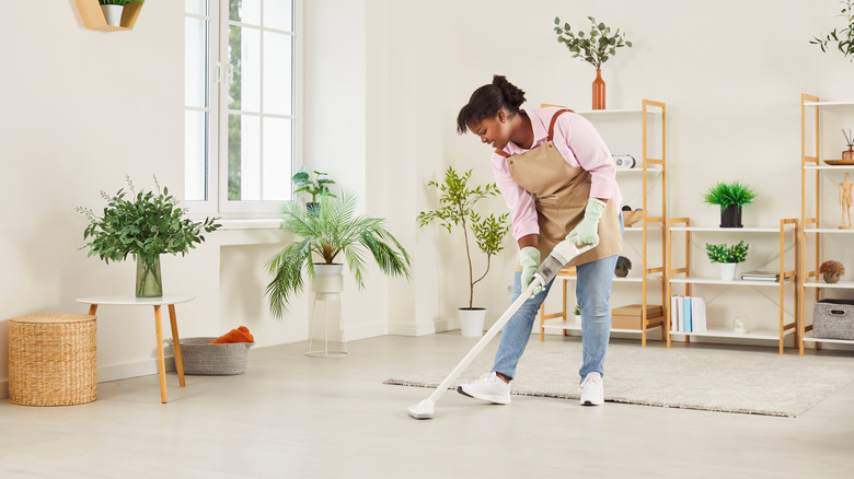 woman using a vacuum cleaner