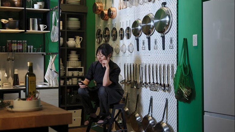 IKEA SKÅDIS pegboard with hanging cooking pots and pans