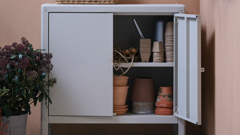 IKEA's KOLBJÖRN indoor/outdoor cabinet filled with garden potting supplies