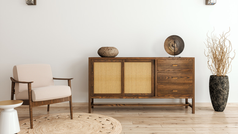 Elegantly designed living space featuring a harmonious blend of vintage wooden furniture with modern touches and neutral color palette