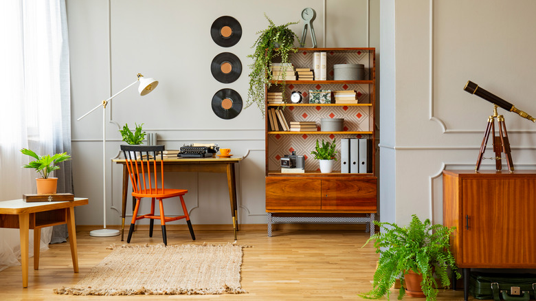 Wooden furniture in a retro home office interior