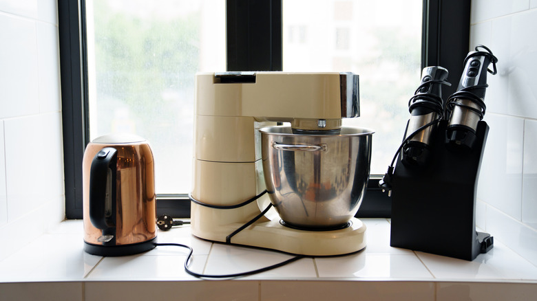 Three small kitchen appliances on a counter