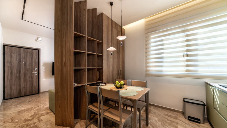A wood partition between kitchen and living room