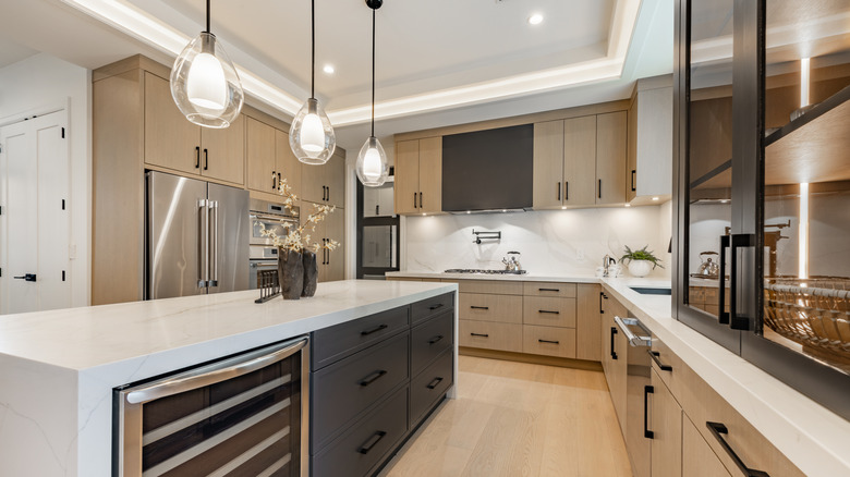 A modern kitchen with layered lighting