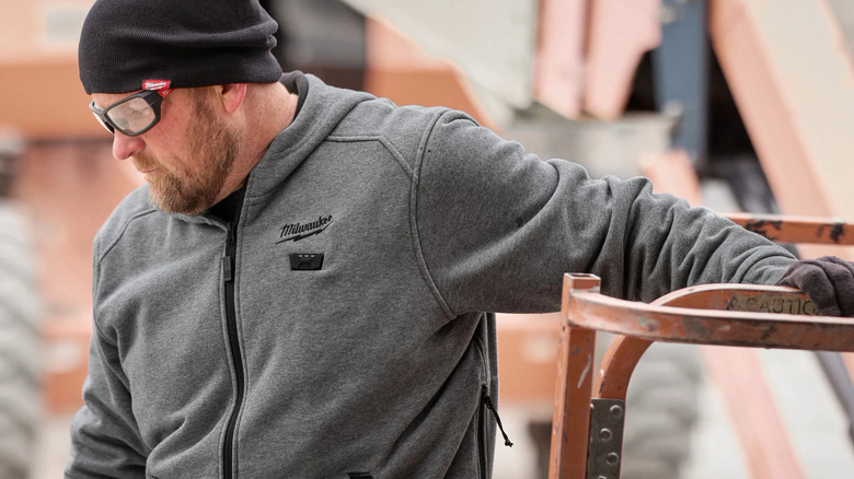 A person wearing Milwaukee's M12 heated Jacket Hoodie