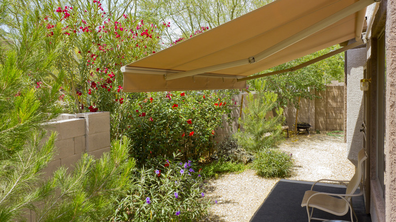 A retractable awning installed in a garden