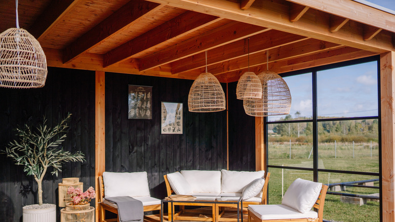 A patio covered by a veranda roof