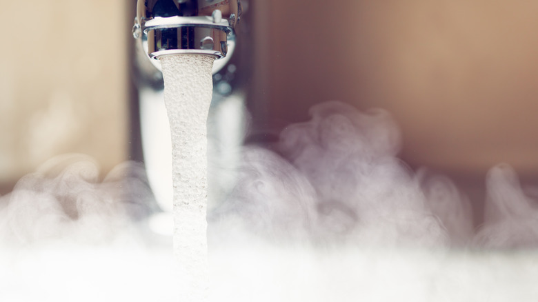 Hot water flowing out of a tap