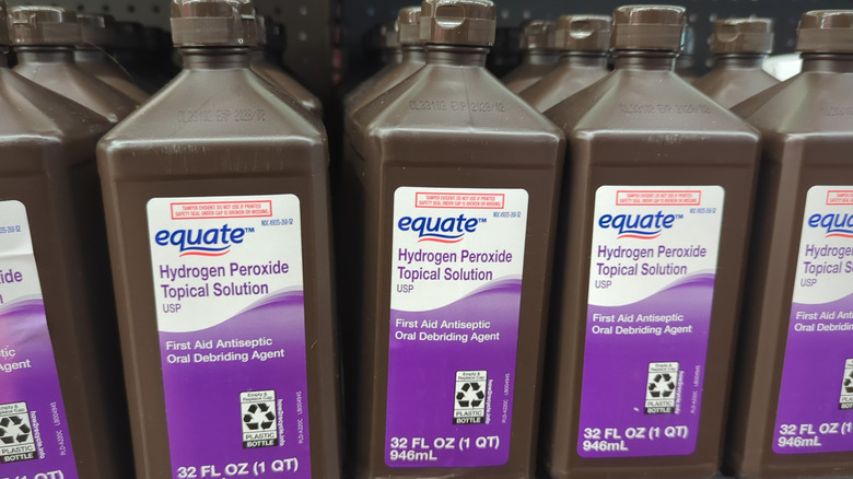 Bottles of hydrogen peroxide on the shelves in a store