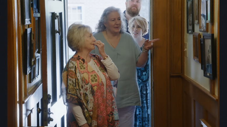 Ben and Erin Napier showing off their family gallery walls in their hallway