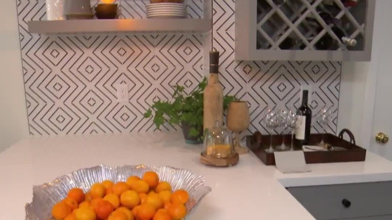 Striped tiles create a geometric patterned backsplash