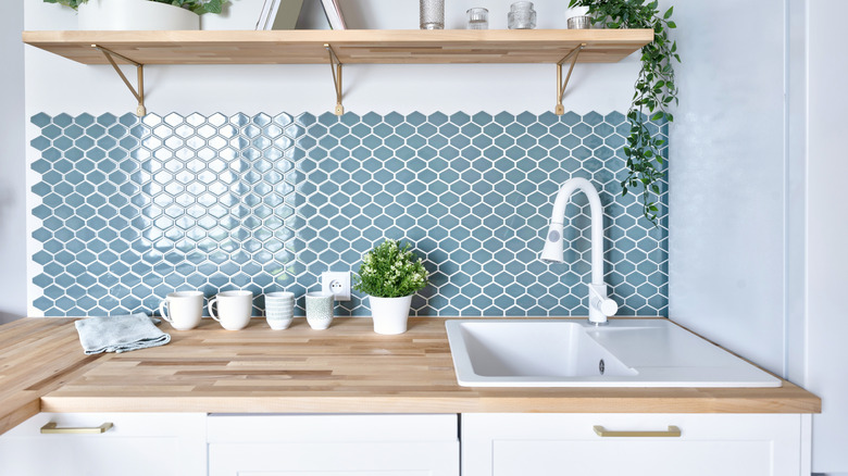a scalloped style of tile for a kitchen backsplash