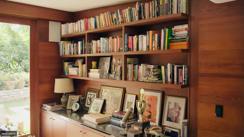 Bookshelf with books and trinkets.