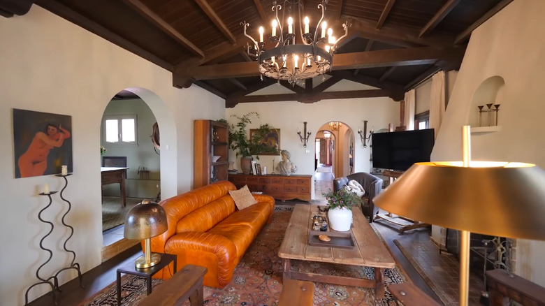 Living room with a sofa and various lighting.