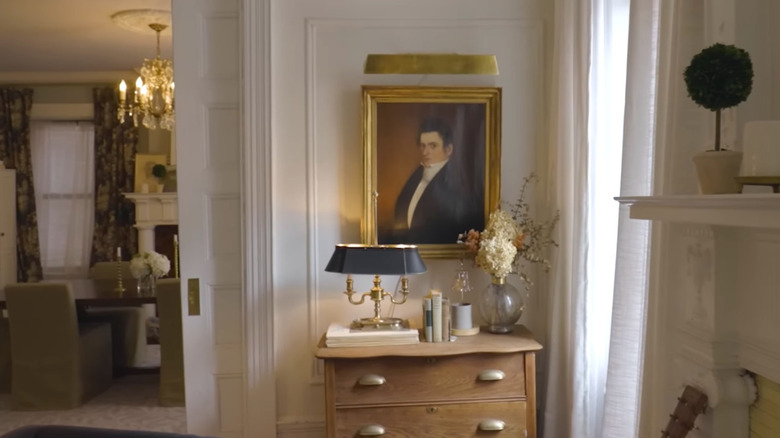 Painting hanging on the wall.