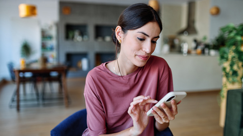 Woman using her cell phone.