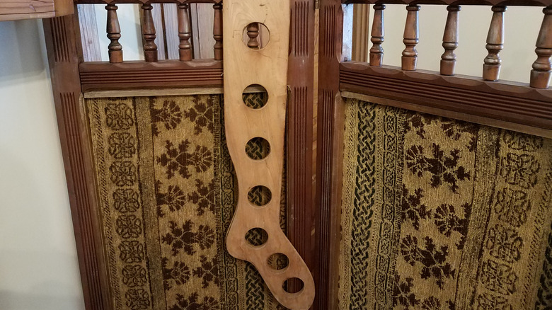 Sock stretcher on a wood room divider