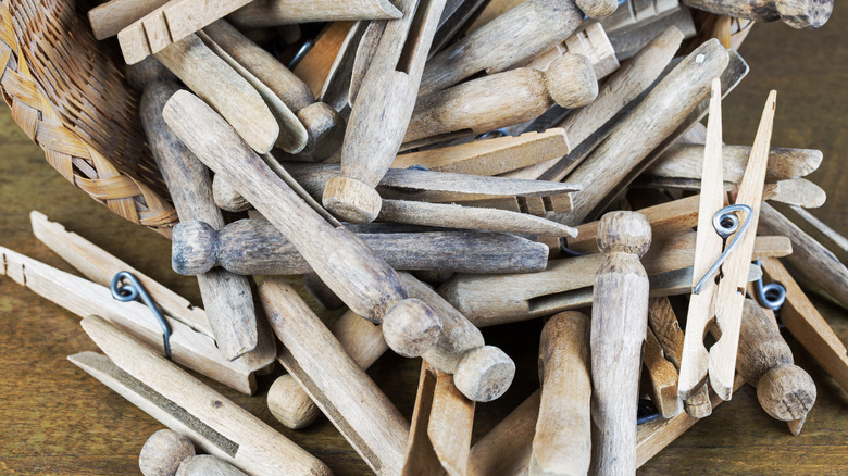 A basket of vintage wooden clothespins