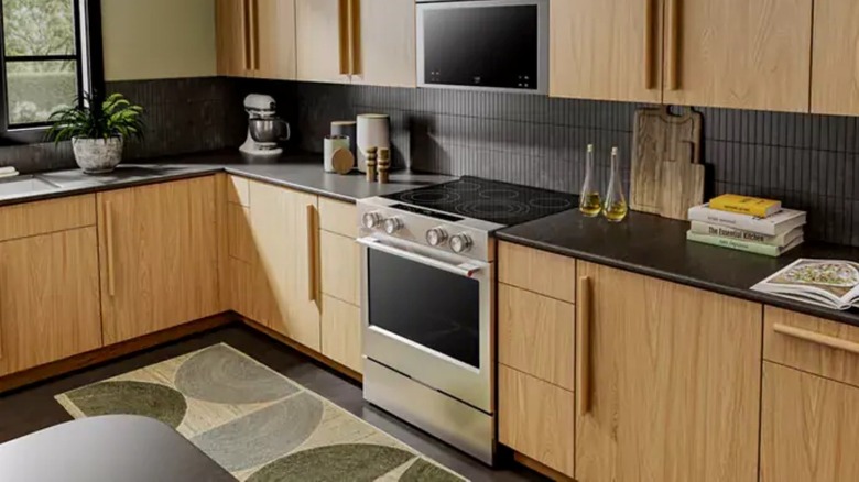A KitchenAid oven in a kitchen with wood cabinets