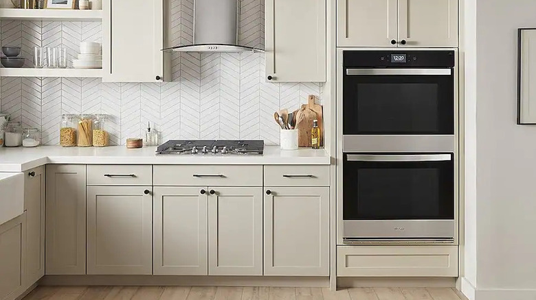 Double oven installed in white kitchen cabinets
