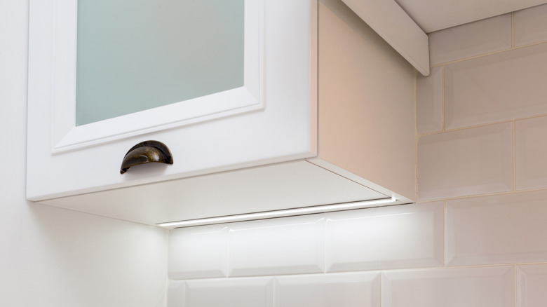 Closeup of the underneath of a kitchen cabinet