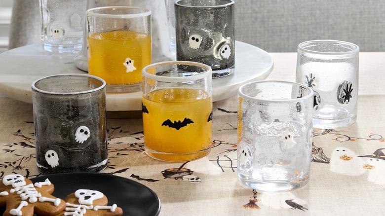 Halloween-themed drinking glasses on a table