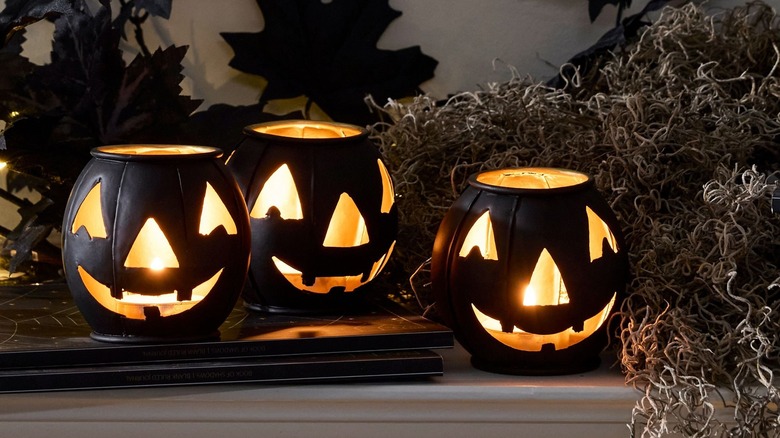 Lit up jack-o'-lantern candle holders