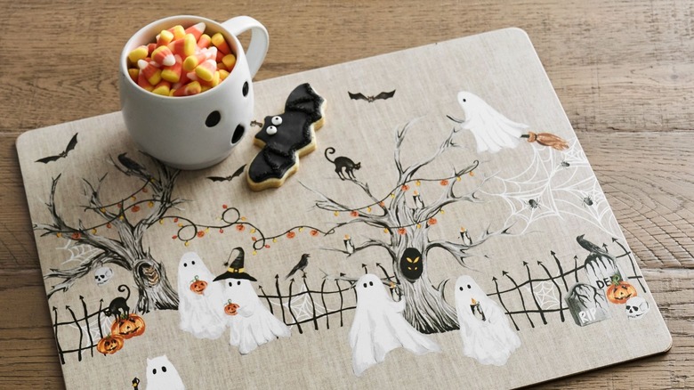 Ghost-themed placemat with ghost mug on it