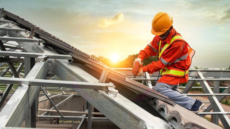 person installing new roof