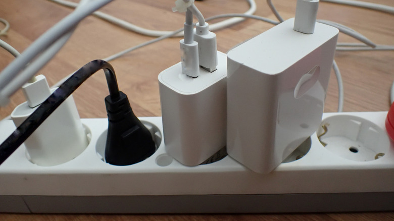 Multiple devices plugged into outlets via adaptors