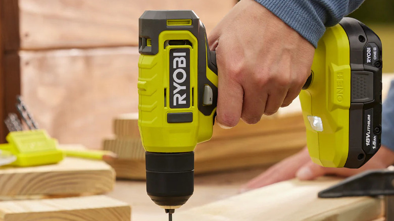 Close-up of a person using Ryobi's 18V Cordless Drill/Driver