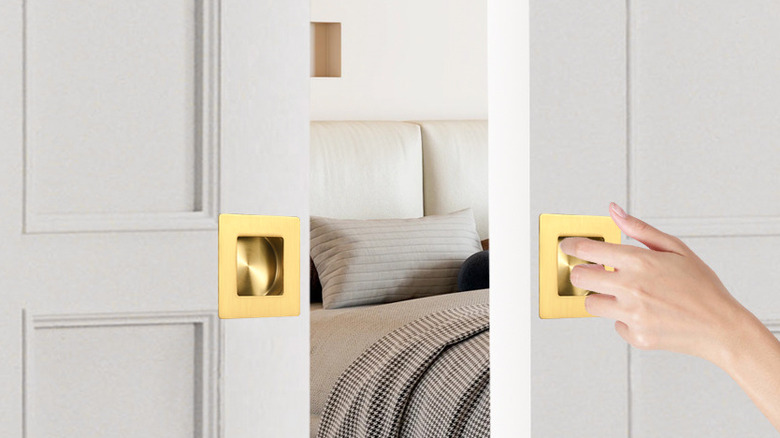 A person pulls a square HOMOTEK Recessed Handle to open a sliding closet door