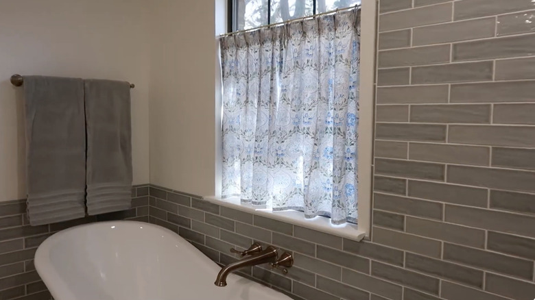 Cafe curtains installed on a bathroom window