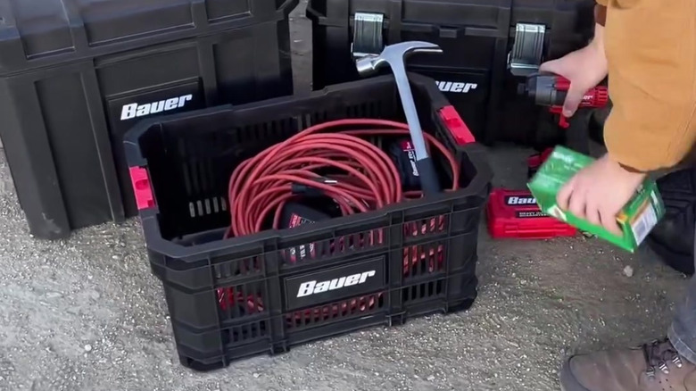 Bauer's black and red modular storage holding cable and hammer