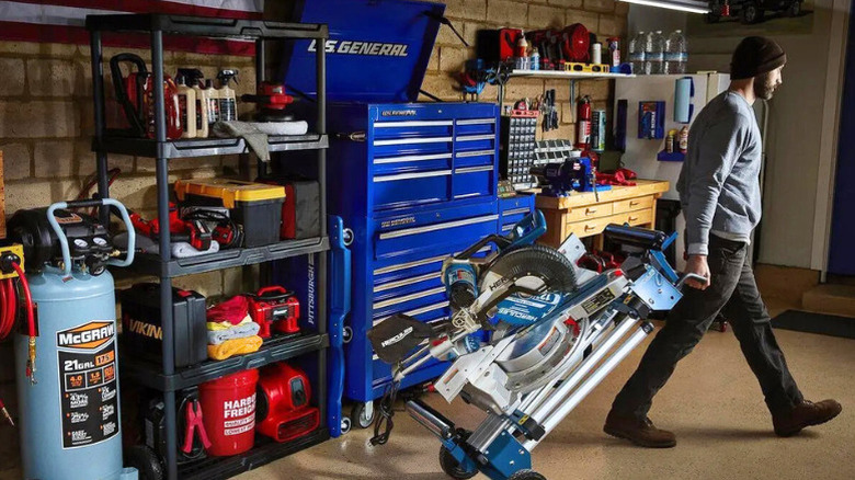 A garage with a 5-tier shelf loaded with tools