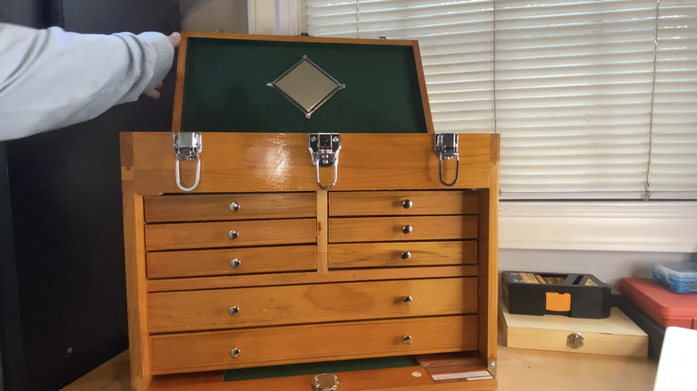 wooden tool chest with safety mirror being opened